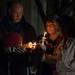 Julia Niswender's parents Jim and Kim Turnquist along with her twin sister Jennifer and younger sister Madison Turnquist all light candles during a vigil held Dec. 14 at EMU's Big Bob's Lake house. Julia Niswender was the victim of an apparent homicide, police say.
Courtney Sacco I AnnArbor.com 